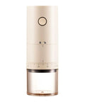 Portable Electric Burr Coffee Grinder With 38 Adjustable Grind Settings For Espresso French Press in beige, USB rechargeable with clear container.