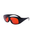 Slick Laser Safety Goggles Featuring Badass OD7 Plus Optics Covering Deep Ultraviolet And Green Beams Across Critical Wavelengths For Precision Lab Safety Gear in sleek design with red tinted lenses.