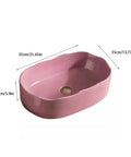 UMJIGF Vessel Sink Household Washbasin Bathroom Above Counter Basin in pink, 55cm x 35cm x 15cm, oval shape with drain hole.