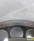 Close-up view of New 22215 Ek C3 Spherical Roller Bearing 130Mm X 75Mm X 31Mm with visible model engraving and steel finish.