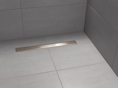 Heavy Duty 24 Inch Reversible Linear Shower Drain Trim Kit In Brushed Stainless Steel installed in tiled shower floor.