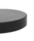 Close-up of Granite Parasol Base Beefy 62.8 Lb Round Black Outdoor Umbrella Stand showcasing solid construction edge