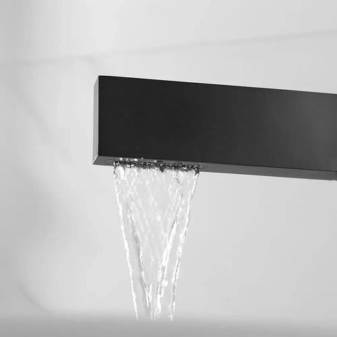 Matte Black Ultra Thin Vessel Sink Faucet With Single Handle Waterfall Spout in action, showcasing water flow.