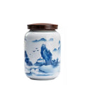 Top Shelf Airtight Ceramic Tea Canister Keeping Freshness Locked Inside Retro Blue And White Landscape Vibes large pantry storage jar with brown lid.