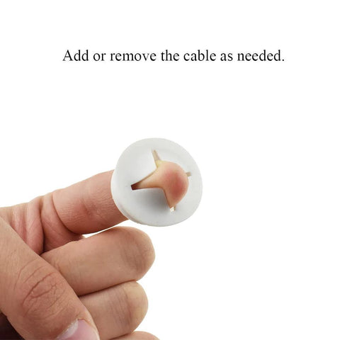 4 Pack White Flexible Rubber Desk Grommets 1 Inch Hole Covers For Cable Management held between fingers