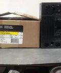 Top Shelf Three Pole Thermal Magnetic Circuit Breaker Rated At One Hundred Amps And Two Forty Vac With Terminal Lugs.