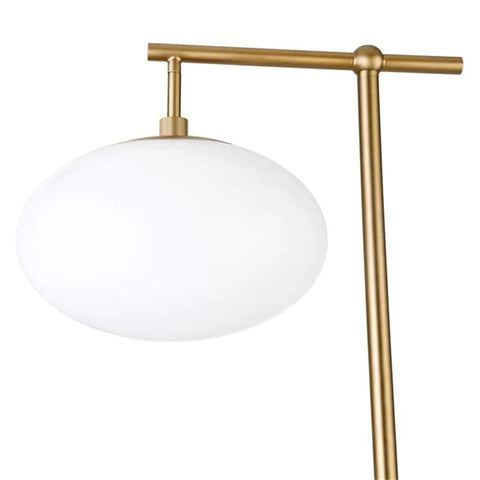 Go To 68 Inch Tall Arc Floor Lamp With Glass Shade In Brushed Brass And Milk White, close-up of milk white glass shade and brass arc.