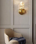Modern Copper Crystal Wall Sconce Straight Up Stunning For Living Room And Bedroom Top Tier Bedside Lamps With Glare Free Hand Cut Shades Giving Your Space A Total Glow Up mounted on wall with crystal diffuser and gold accents.