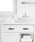 Vanity with Six Piece Leather Drawer Pulls Set In Brown With Gold Rivet Screws, 4.72 Inch Soft Cabinet Dresser Handles in a bathroom setting.