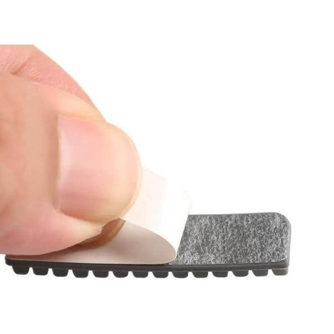 Close-up of hand peeling adhesive backing on heat resistant silicone brush from 8Pcs Heatbed Nozzle Brush Replacement Kit For A1 3D Printer.