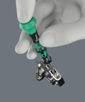 Hand holding Modular Micro 21-Piece Tool-Check Bit Set With Bit-Holding Screwdriver, Ultra Compact 4 mm Hex Drive in use.