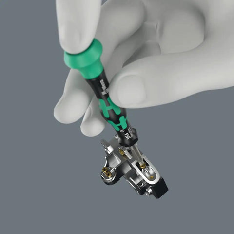 Hand holding Modular Micro 21-Piece Tool-Check Bit Set With Bit-Holding Screwdriver, Ultra Compact 4 mm Hex Drive in use.