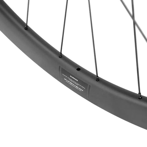Close-up of Carbon Disc Wheelset 50mm Depth 25mm Width Clincher 700c Center Lock Thru Axle Slick Glossy Black U-Shape Rim