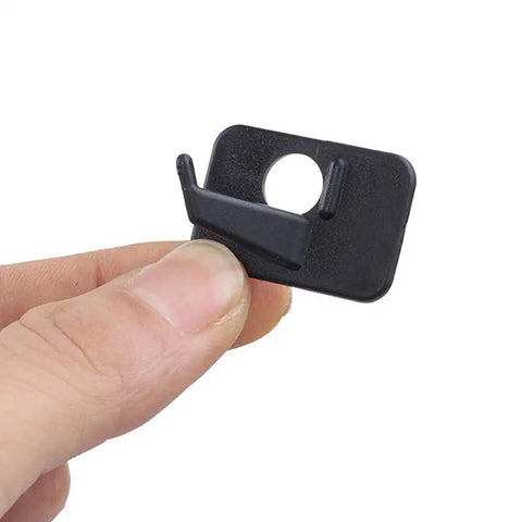 Close-up of a Six Pack Plastic Arrow Rest for Recurve Bow Black Self Adhesive Arrow Rest held in hand