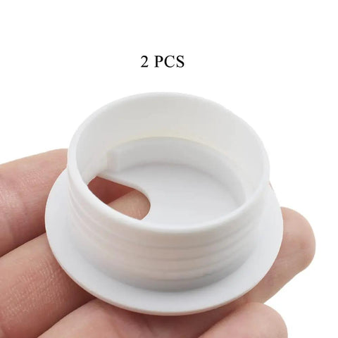 Heavy Duty U Shaped Desk Wire Grommets Kick Cable Clutter To The Curb With These Thick White Abs Plastic Cord Hole Covers 1.5 Inch Desk Grommet Two Pack, showing a white grommet cover in hand.