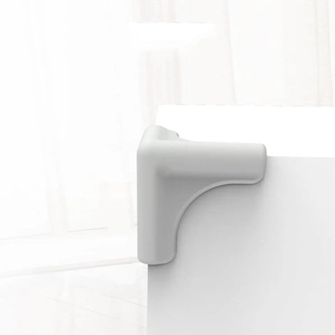 Silicone Corner Guards For Furniture And Home Appliances, Impact Resistant Edge Guards on a desk corner view