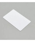 230 Pack White Blank PVC Cards Inkjet Printable Waterproof Plastic ID And Business Badges lying flat on a gray surface.