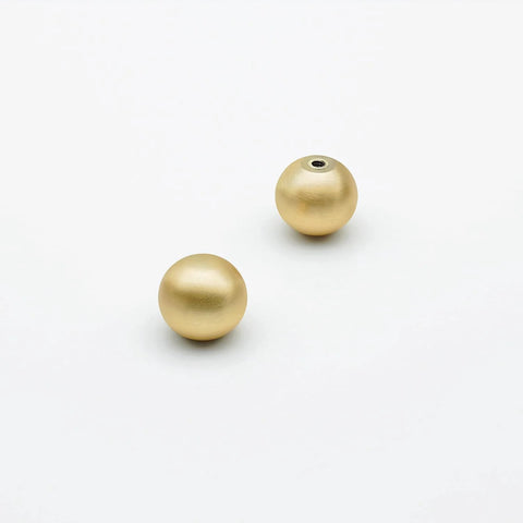 Two pieces of 10 Pack Brushed Gold Ball Cabinet Knobs 1 Inch Diameter Zinc Alloy Drawer Pulls, showing brushed gold finish.