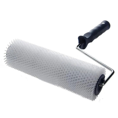 Slick 13mm Spiked Paint Roller With Ergonomic Plastic Handle For No Sweat Bubble Removal And Crisp Wall Prep. White spiked roller on handle.