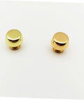 Gold suitcase-style bag feet rivets; two metal handbag studs, front view