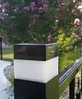 Eight Pack Solar LED Fence Post Caps 2x2 Inches For Wrought Iron And Aluminum Or Garden Posts Black And White Auto On At Dusk Off At Dawn Rechargeable Ni MH Battery Included on a garden post