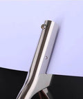Close-up of Beast Mode Heavy Duty Single Hole Punch Tool punching white paper, chrome finish, visible 3mm hole