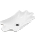 HAOCHRYSYPH Ceramic Shell Vessel Sink Bowl, Milk White, 24.41x13x4.73 in. smooth, artistic seashell design with a drain hole.