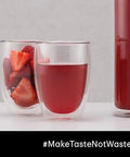 Set Of Six Double Wall Insulated Glass Tumblers Twelve Ounce Capacity Heat Resistant Borosilicate Construction Clear Look with red drink and fresh strawberries.