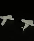 Two white Four Pack Nylon RC Airplane Tip Protectors Wing Tip Guards for planes and helicopters on black background