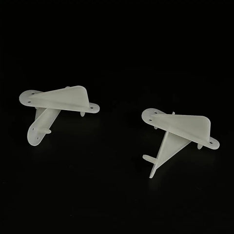 Two white Four Pack Nylon RC Airplane Tip Protectors Wing Tip Guards for planes and helicopters on black background