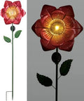Red fiber optic poppy solar garden stake with dusk to dawn sensor, 48 inches tall, shown illuminated for outdoor use in yard decor.