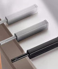 Close-up of 4 Pack Magnetic Push Latch Kit showing three latches in white, gray, and black for hidden cabinets and drawers.