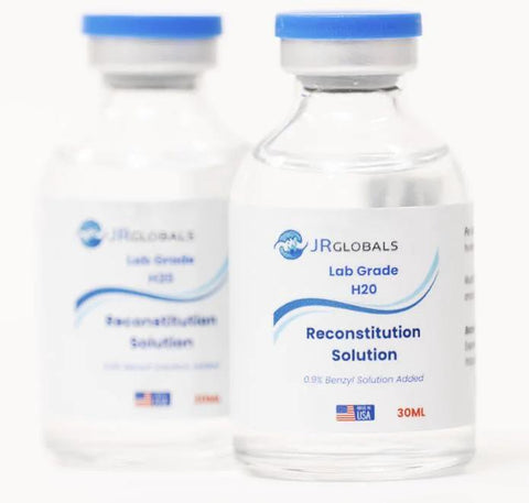 Front view of two 30mL JR Globals Reconstitution Solution glass vials with blue caps