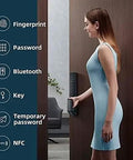 Woman using Zero Hassle Smart Door Lock Featuring Fingerprint Scan And Numeric Password Keyless Entry Automatic Electronic Deadbolt App Managed.