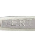 Close-up of a Ti-1 Titanium TIG Welding Rod Grade 1 36 Inch Long 0.045 Inch Diameter, showing engraved detail on metal surface.
