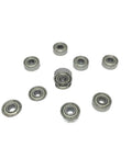 50 Pack Deep Groove Ball Bearings 4x11x4 mm Shielded 694ZZ R-1140ZZ Miniature Bearings displayed in a scattered arrangement