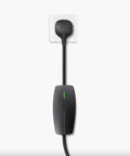 Tesla Mobile Connector Portable EV Charger Level 2 Up To 32 Amps With 20 Ft Cable plugged into a standard outlet.