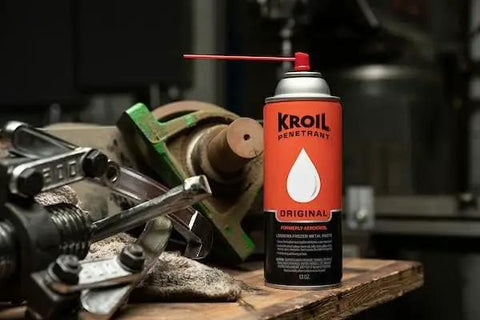 Aerokroil Penetrant Rust Penetrating Lubricant And Corrosion Inhibitor Oil For Chains Hinges And Stuck Metal Parts Great For Home And Industrial Use Aerosol 13 Oz 1 Pack can on a workshop table next to tools