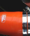 Scandvik 13670 stainless steel hose clamp on orange hose; two clamps visible, 44-70 mm range