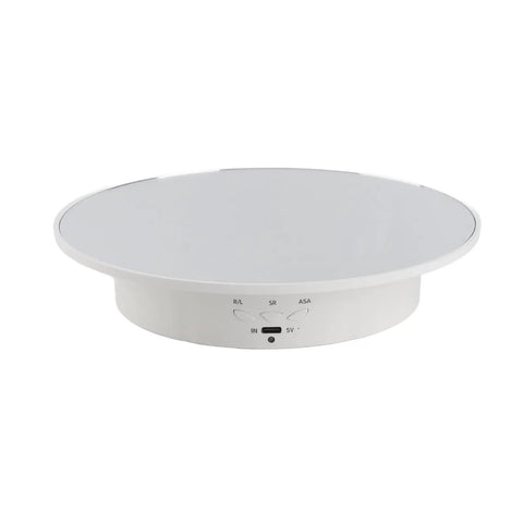 This Badass 360 Degree Electric Rotating Display Turntable Slams With 8Kg Load Capacity And Three Adjustable Speeds For Video And Photography, Totally Perfect For Showcasing Any Product In A Mirror Finish, compact white design with control buttons.