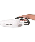 Hand holding Go-To Compact 18V LXT Cordless Vacuum Tool Only White With A Redesigned Floor Nozzle For Easy Maneuvering And Strong Suction