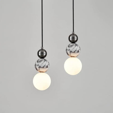 Aolyzmt Natural Alabaster Marble Pendant Light, Modern Cylinder LED Hanging Lamp, Black Gold Ceiling Light Fixture with Frosted White Glass Shade for Kitchen Island, Dining Room, Living Room, Bedroom with spherical design.