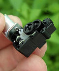 M20 DC Worm Gear Motor Operating At 3V To 5V Serving Up Smooth 150 RPM Punch Inside A Compact Turbo Reduction Box, shown in hand.