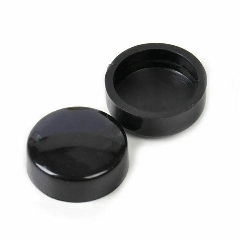 Close-up of black snap-on bolt covers from 8 Pack Black License Plate Screw Caps For Cars, Trucks, And Vans, Universal Fit