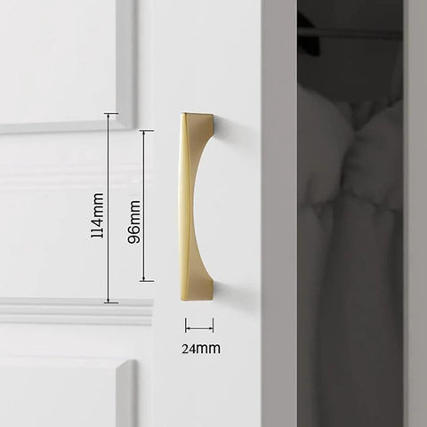 Installed view of 4 Pack Brushed Gold Cabinet Drawer Pulls in zinc alloy with brushed brass finish, 96mm hole pitch on white cabinet