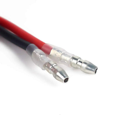 Close-up view of solder tabs on 540 Brushed RC Motor 55T Waterproof for 1/10 Scale Crawlers, showing red and black wires.