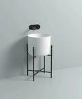 Bathroom Sink Cylindrical White Ceramic Bathroom Vessel Sink Wall Mount Bathroom Sink No Overflow Hole Porcelain Vanity Sink Basin, Ceramic Sink Only Lavatory Vanity, with black stand mounted on wall.