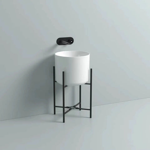 Bathroom Sink Cylindrical White Ceramic Bathroom Vessel Sink Wall Mount Bathroom Sink No Overflow Hole Porcelain Vanity Sink Basin, Ceramic Sink Only Lavatory Vanity, with black stand mounted on wall.