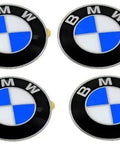 Set of four black gloss BMW wheel center cap emblems for E46 E60 E90 E92 models, 64.5mm OEM replacement, ready to install.