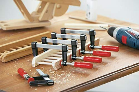 Heavy Duty General Purpose Clamp With Zinc Die Cast Jaws Delivers Up To 330 Pounds Of Clamping Power, shown securing wood pieces